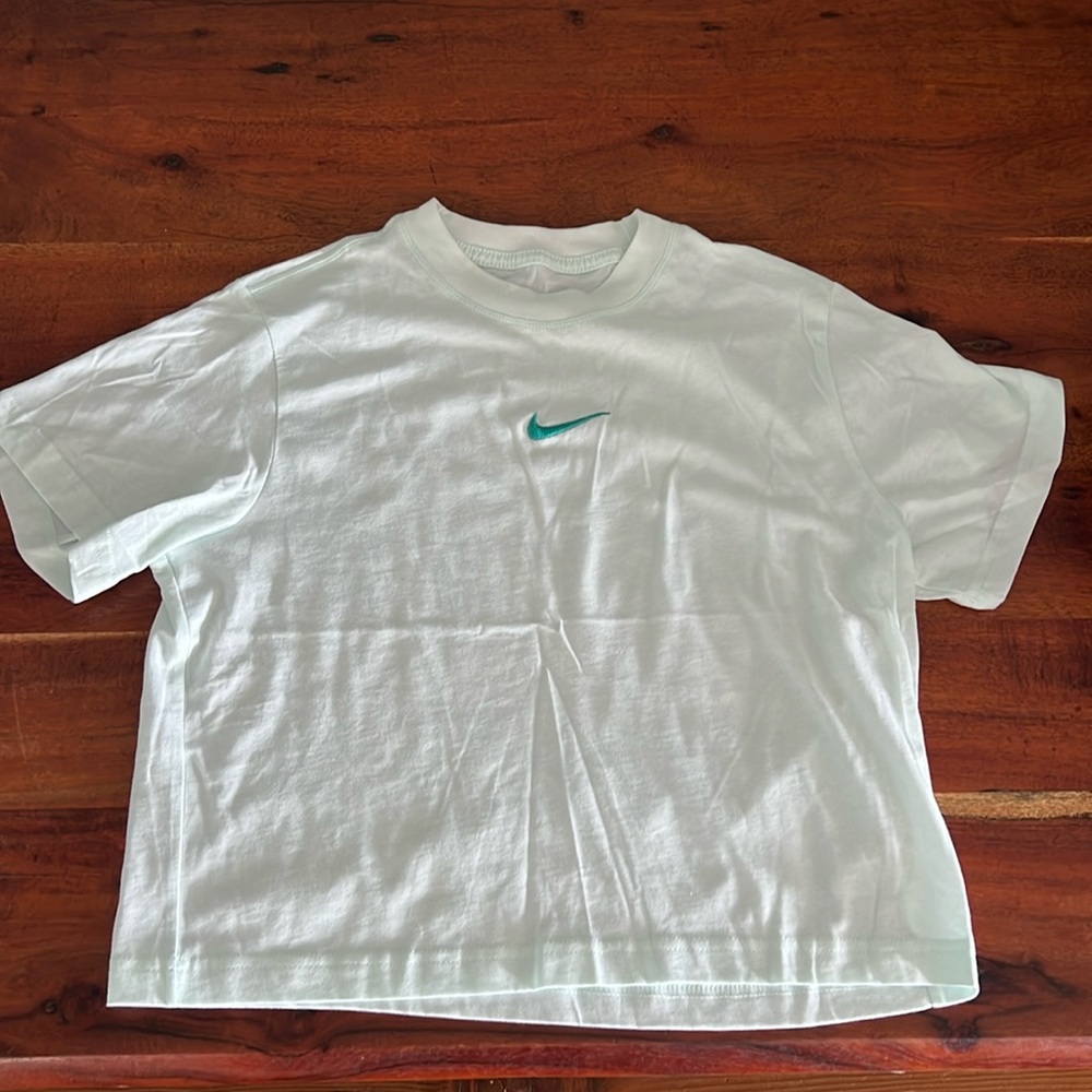 Never worn Nike T-shirt, mint color with teal colored swoosh